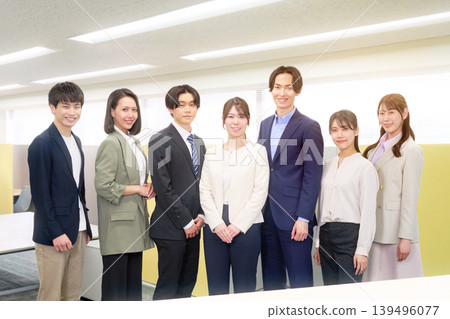 A group photo of young business professionals standing side by side. A group photo of young business professionals standing side by side. 139496077
