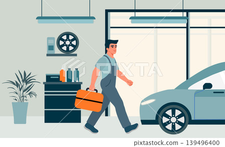 Mechanic walking in modern auto repair shop with tools in hand and approaching electric car 139496400