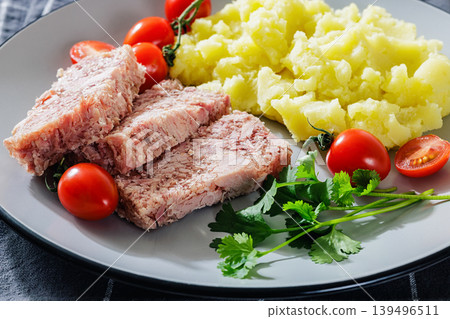 Slices of classic head cheese with mashed potatoes 139496511