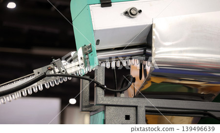 PET bottle machinery. Automated plastic bottle manufacturing machine operating on factory production line. Robot machine for bottle preform or forming packaging high speed plastic container production 139496639
