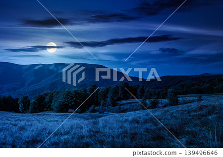 mountainous rural landscape in summertime at night. full moon over picturesque highland woods and grassy meadow. view of mysterious countryside scenery with forested hills behind the pasture mountainous rural landscape in summertime at night. full moon over picturesque highland woods and grassy meadow. view of mysterious countryside scenery with forested hills behind the pasture 139496646