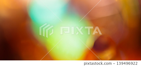 Dramatic bokeh background with glowing teal green and warm amber defocused light circles Dramatic bokeh background with glowing teal green and warm amber defocused light circles 139496922