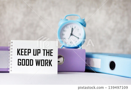 A notebook with the inscription Keep up the good work on a light background A notebook with the inscription Keep up the good work on a light background 139497109
