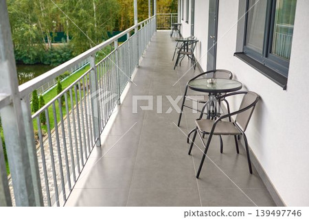 Serene balcony overlooking tranquil waters Serene balcony overlooking tranquil waters 139497746