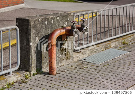 Orange pipe in city setting 139497806