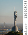 Motherland Monument in Kyiv with raised sword and shield, overlooking the Dnieper River, bridge and city panorama in Ukraine 139498065