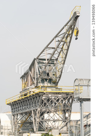Old industrial Harbor Cargo Crane with Hook and Lattice Boom, Venice Italy 139498066
