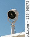 Ship searchlight on vessel against blue sky 139498072