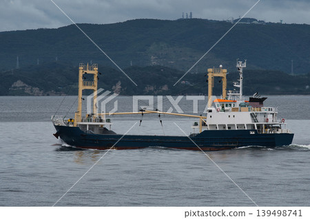 Coastal cargo ships sailing on the open sea Coastal cargo ships sailing on the open sea 139498741