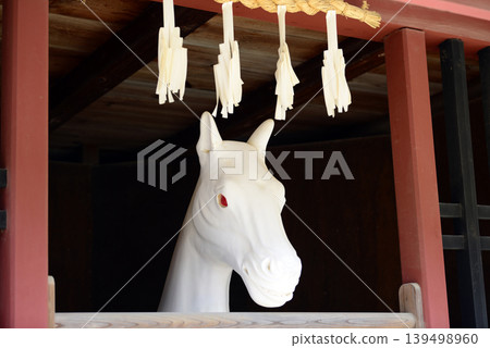 The sacred horse on the approach to Itsukushima Shrine in Miyajima, Aki Province 139498960