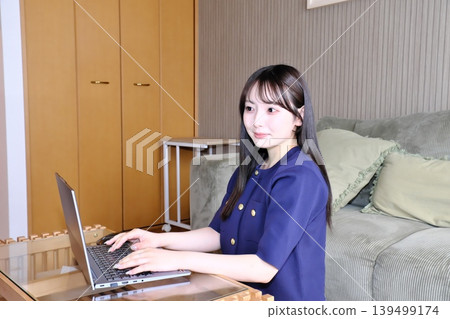 A peaceful moment for oneself. The daily life of a woman enjoying the internet and hobbies in a relaxed space. A peaceful moment for oneself. The daily life of a woman enjoying the internet and hobbies in a relaxed space. 139499174