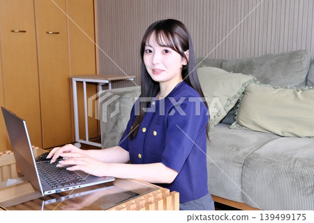 A peaceful moment for oneself. The daily life of a woman enjoying the internet and hobbies in a relaxed space. A peaceful moment for oneself. The daily life of a woman enjoying the internet and hobbies in a relaxed space. 139499175