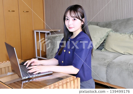 A peaceful moment for oneself. The daily life of a woman enjoying the internet and hobbies in a relaxed space. A peaceful moment for oneself. The daily life of a woman enjoying the internet and hobbies in a relaxed space. 139499176