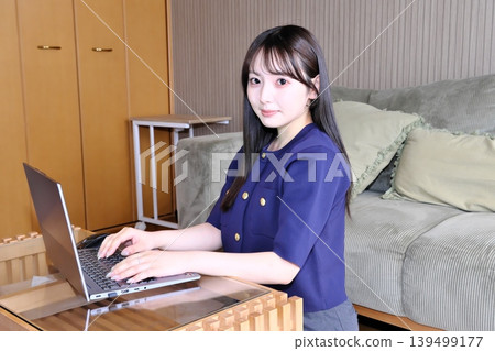 A peaceful moment for oneself. The daily life of a woman enjoying the internet and hobbies in a relaxed space. A peaceful moment for oneself. The daily life of a woman enjoying the internet and hobbies in a relaxed space. 139499177