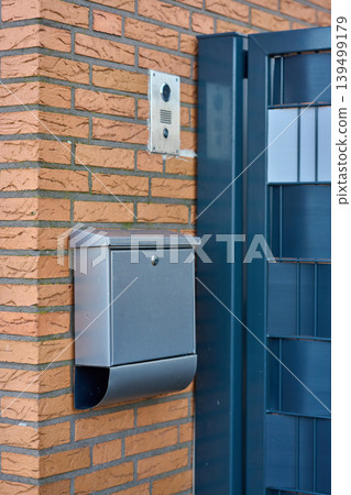 Modern mailbox on brick wall Modern mailbox on brick wall 139499179