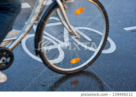 Riding on a rainy path Riding on a rainy path 139499212