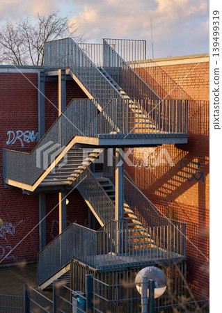 Sunlit steel stairs 139499319