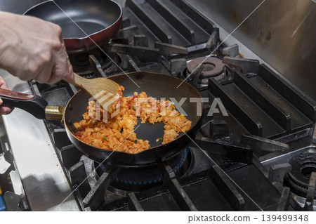 A scene of cooking fried rice. A scene of cooking fried rice. 139499348