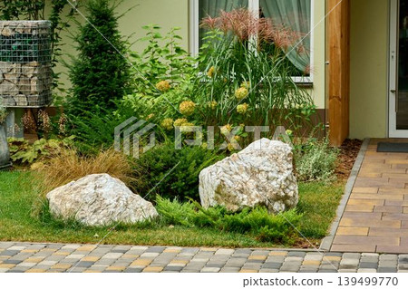Entrance to the building with gabions and garden stones 139499770