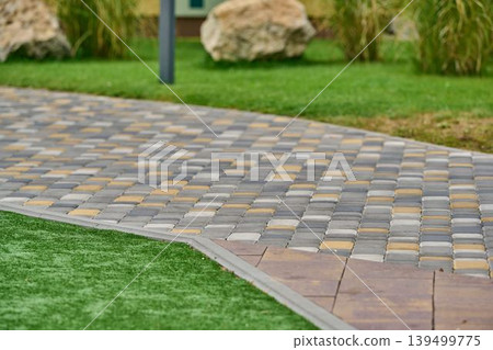 Winding paved path through the park. Winding paved path through the park. 139499775