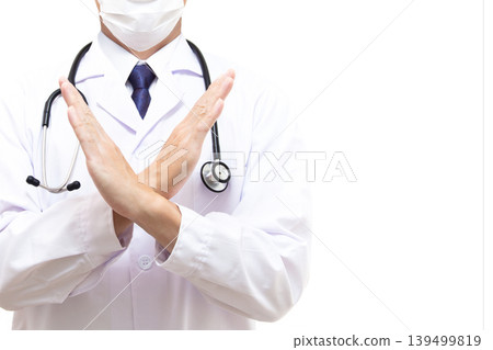 A male doctor making an "X" sign (copy space) A male doctor making an "X" sign (copy space) 139499819