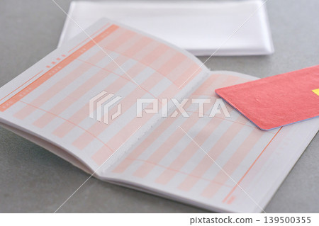 A bank passbook placed on the table A bank passbook placed on the table 139500355