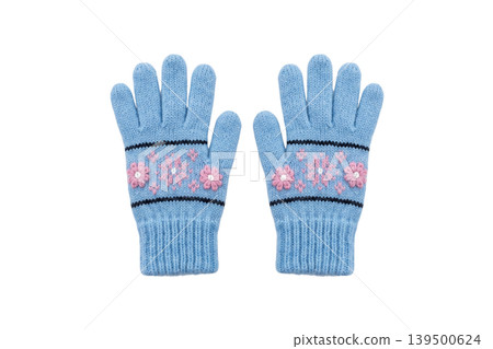 Blue knitted winter gloves with pink floral embroidery isolated Blue knitted winter gloves with pink floral embroidery isolated 139500624