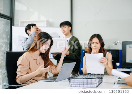Stressed business team dealing with problem and deadline pressure in office meeting, showing conflict, frustration, and workplace challenges Stressed business team dealing with problem and deadline pressure in office meeting, showing conflict, frustration, and workplace challenges 139501563