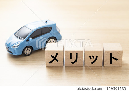 Blocks with the word "Merit" written on them and eco-cars Blocks with the word "Merit" written on them and eco-cars 139501583