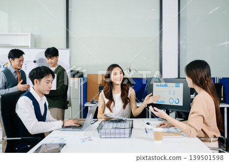 Business team discuss at meeting room. working together with laptop ,tablet and smart phone on desk Financial accountant , planner , meeting , introduction concept. 139501598