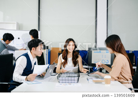 Business team discuss at meeting room. working together with laptop ,tablet and smart phone on desk Financial accountant , planner , meeting , introduction concept. 139501609