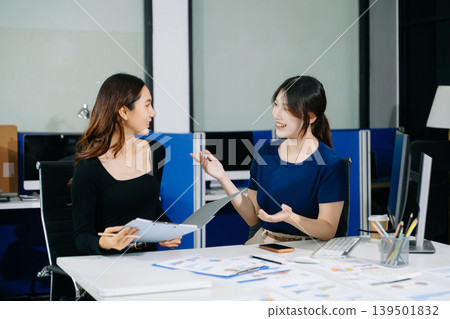Asian businesswomen collaborating in a modern office, mentoring and teamwork driving productivity, strategy, and startup success Asian businesswomen collaborating in a modern office, mentoring and teamwork driving productivity, strategy, and startup success 139501832