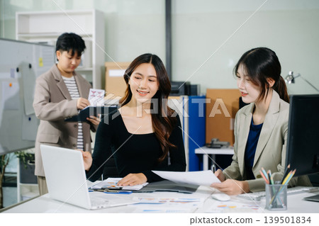 Asian women working together in a startup office, mentoring and collaboration with digital tools to boost productivity, workflow, and business success Asian women working together in a startup office, mentoring and collaboration with digital tools to boost productivity, workflow, and business success 139501834