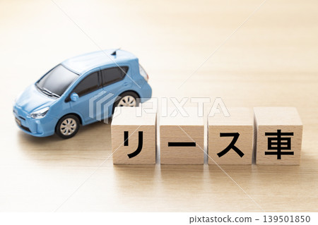 A block with "Leased Car" written on it and an eco-car A block with "Leased Car" written on it and an eco-car 139501850