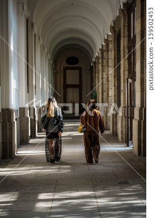 Women Walking Through Historic Corridor at Reina Sofia Museum Madrid Women Walking Through Historic Corridor at Reina Sofia Museum Madrid 139502453