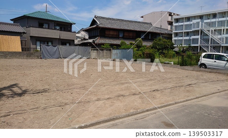 A landscape of vacant land under a blue sky, where construction is planned. A landscape of vacant land under a blue sky, where construction is planned. 139503317