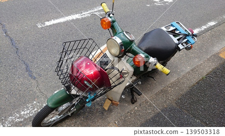 A motorcycle parked on an asphalt road. A motorcycle parked on an asphalt road. 139503318