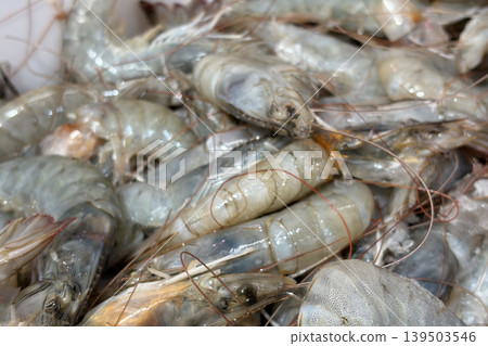 Side view of close up fresh prawns displayed on wet market. Seafood concept. 139503546