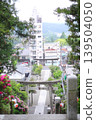 A torii gate viewed from a shrine on a hill. 139504050