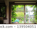 A cafe with a view of the train tracks from the window. 139504051