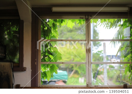 A cafe with a view of the train tracks from the window. A cafe with a view of the train tracks from the window. 139504051