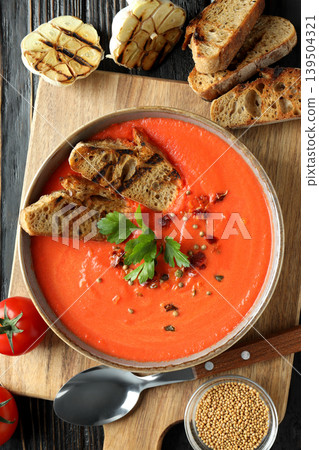 Red soup in a bowl with golden toasted bread slices Red soup in a bowl with golden toasted bread slices 139504321