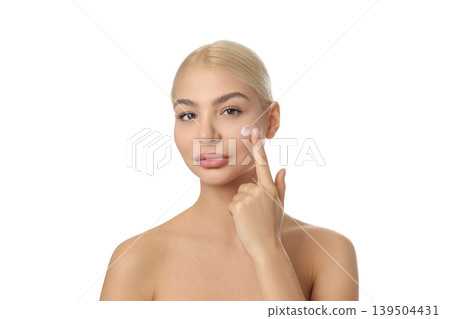 Woman shows skin care routine with cream, isolated on white, PNG Woman shows skin care routine with cream, isolated on white, PNG 139504431