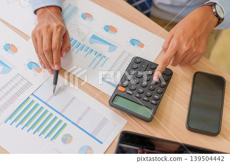 Top View Asian Male 30-40s Accountant Calculating Home Mortgage Costs in Thailand Top View Asian Male 30-40s Accountant Calculating Home Mortgage Costs in Thailand 139504442