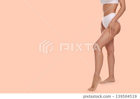 Person highlights their toned legs in a relaxed manner Person highlights their toned legs in a relaxed manner 139504519