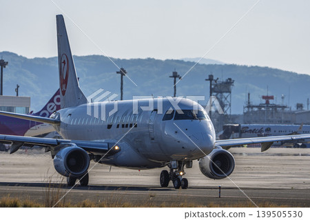 Sendai Airport at dusk, plane taxiing, Natori City, Miyagi Prefecture 139505530