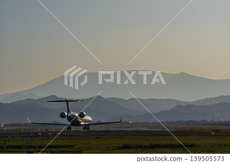 Sendai Airport at dusk, airplane taking off, Natori City, Miyagi Prefecture Sendai Airport at dusk, airplane taking off, Natori City, Miyagi Prefecture 139505573
