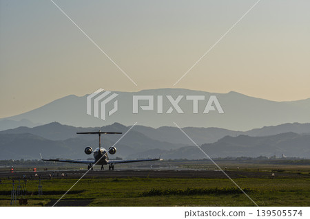 Sendai Airport at dusk, airplane taking off, Natori City, Miyagi Prefecture Sendai Airport at dusk, airplane taking off, Natori City, Miyagi Prefecture 139505574