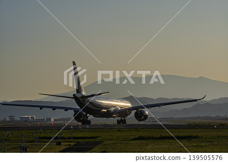 Sendai Airport at dusk, airplane taking off, Natori City, Miyagi Prefecture Sendai Airport at dusk, airplane taking off, Natori City, Miyagi Prefecture 139505576