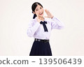 Happy Asian high school student girl in Thai school uniform shouting and announcing with hand around mouth, isolated on white background. 139506439